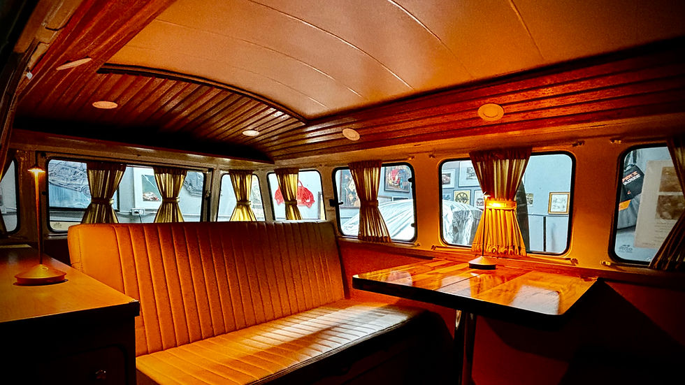 interior retro-fit of a vw bus with wood ceiling and movable table