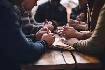 multiethnic-group-people-praying-together_605022-8409.avif