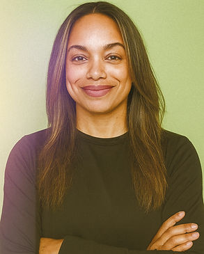Jeanette Romero, Founder and Creative Director of Selbor Studios, smiling in a bright studio workspace