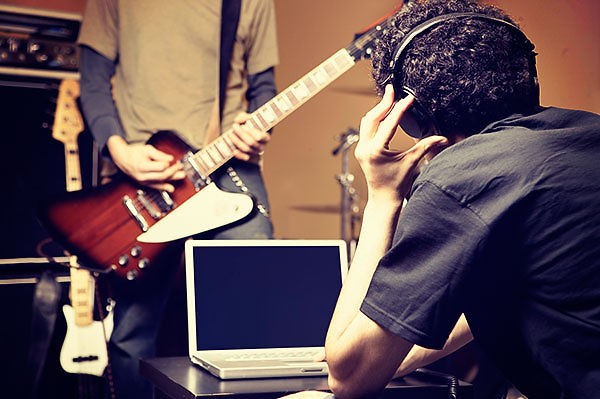 Musicians recording music in back garden music studio based in South East Sussex.