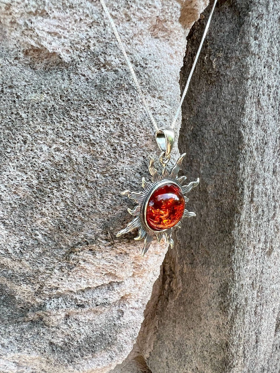 Thumbnail: Silver necklace with amber pendant, SMALL MULTI COLOR Baltic Amber sterling silver ring, on rock.