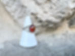 Thumbnail: Ornate silver ring with large amber stone displayed on a white stand.