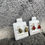 Thumbnail: Two pairs of STERLING SILVER earrings on white stands, amber gemstone details