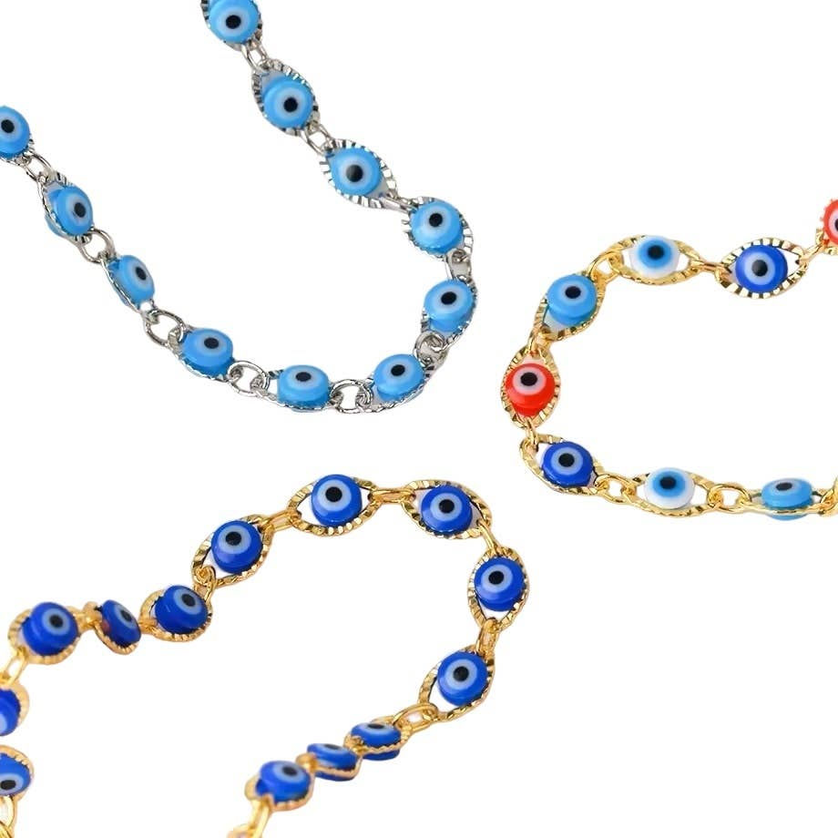 Necklaces with blue, red, and gold evil eye beads on white background.