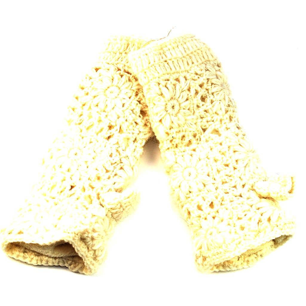 A pair of cream-colored crocheted gloves against a white background.