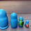 Thumbnail: Blue nesting dolls, turtle, clownfish, and bird displayed on a surface.