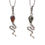 Thumbnail: Two silver snake pendants with gemstone heads on white background.