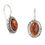 Thumbnail: Amber earrings with ornate sterling silver detailing, close-up shot.