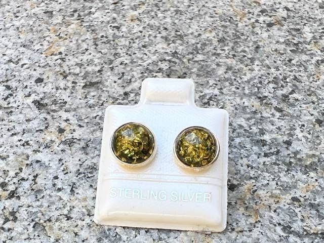 Pair of stud earrings on a white card, STERLING SILVER, close up shot.