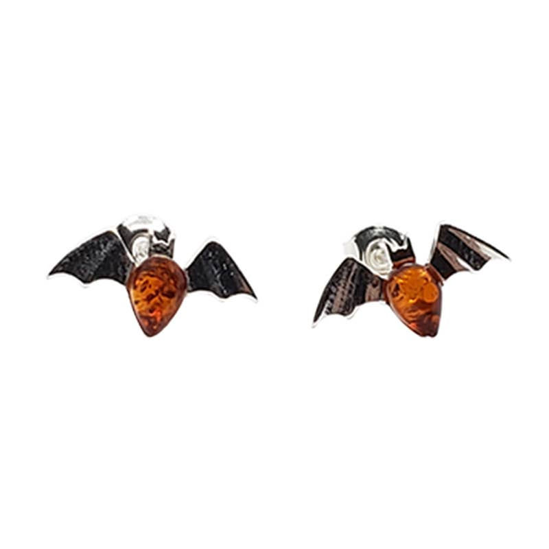 Bat-shaped earrings with amber center and dark wings on white background