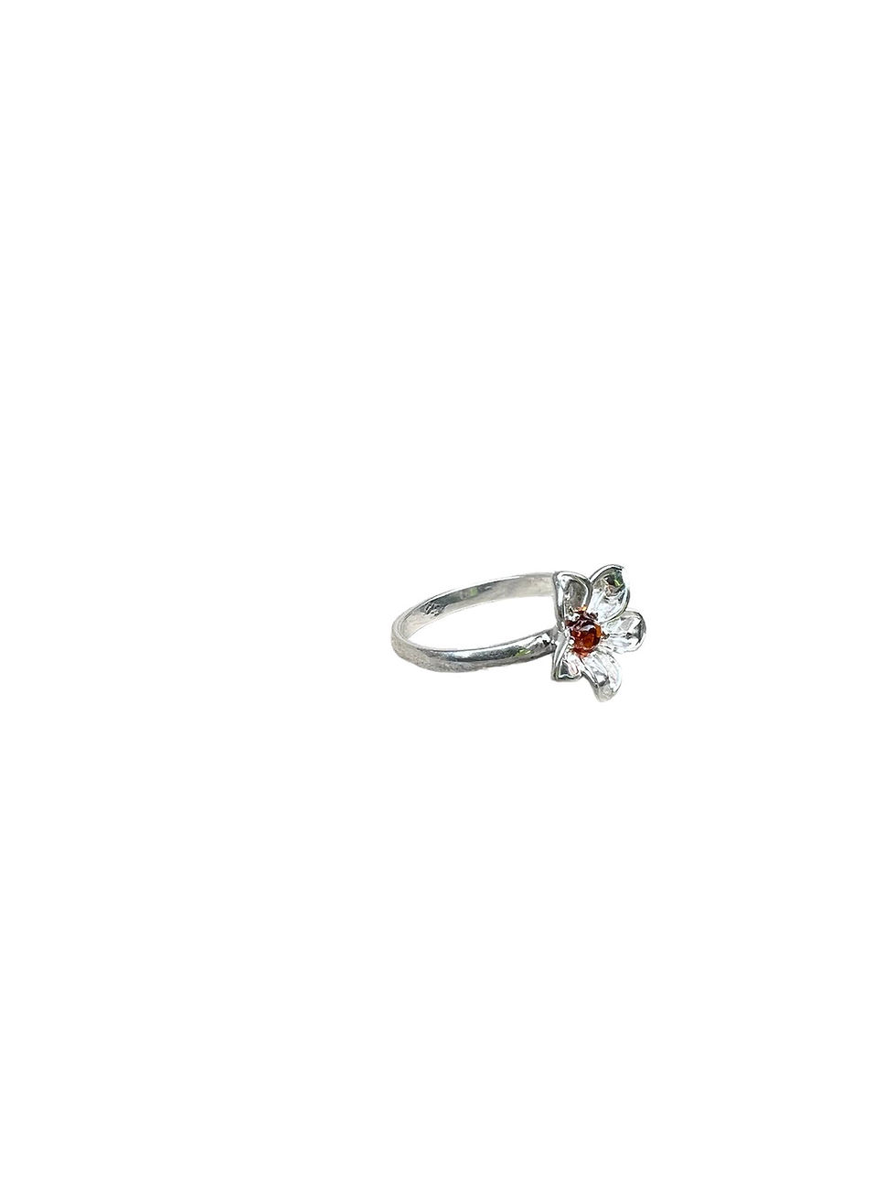 Silver ring with red jewel. Fashion accessory on white background.