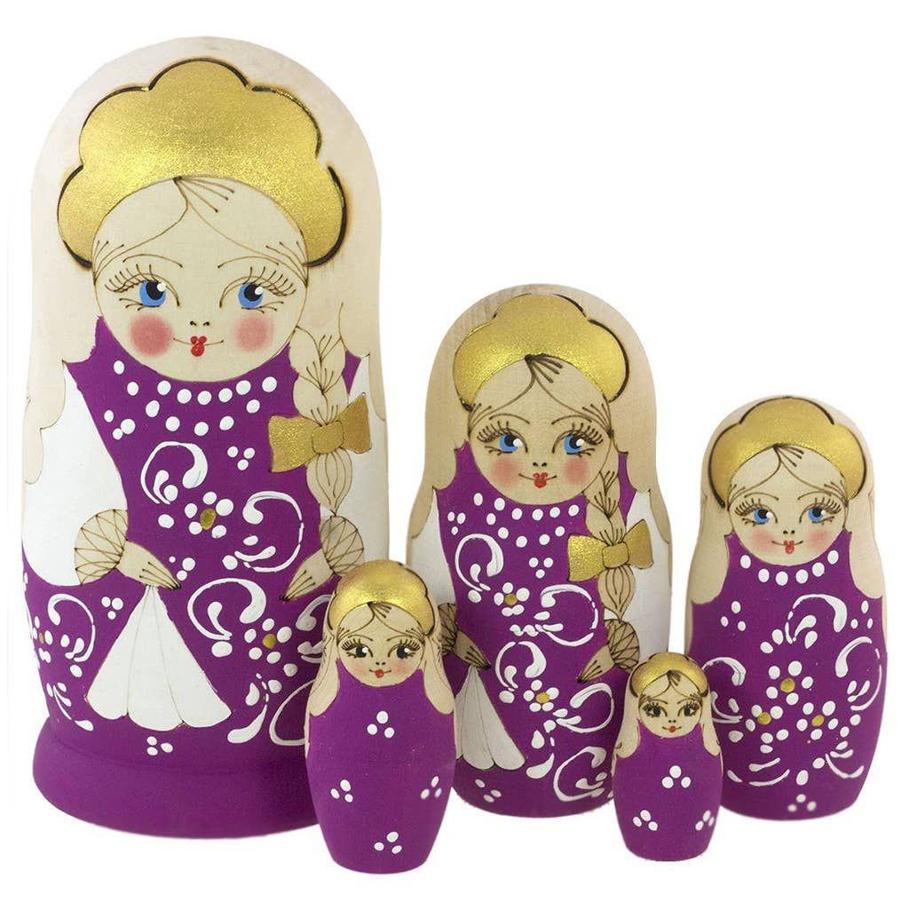 Matryoshka dolls with purple dresses are displayed against a white background.