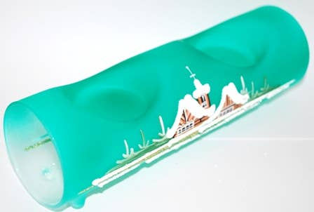 Thumbnail: Turquoise glass with painted houses and white text background detail.