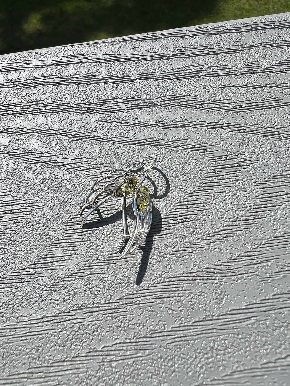 Thumbnail: Baltic Amber SUN sterling silver earrings on a gray wooden surface. Handmade.