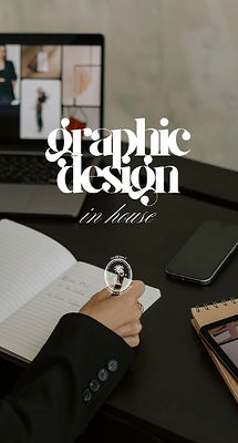 A person's hand holding a pen and writing in a notebook, with a laptop in the background showing a video call.