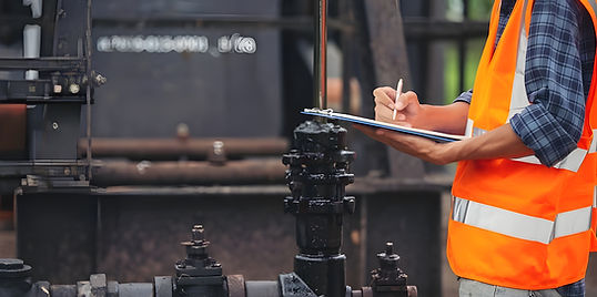 workers-standing-checking-beside-working-oil-pumps_1150-19213 (1).jpg