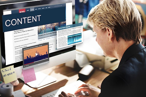 Man working on content strategy with content displayed on computer screen