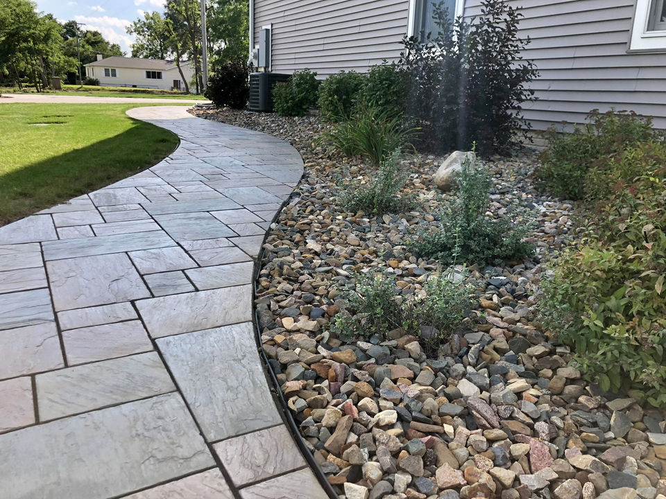 curbed sidewalk with new landscape 