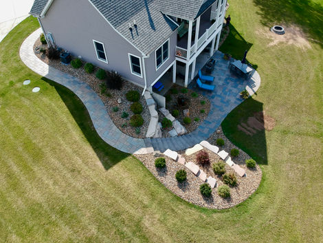 sky view of curved sidewalk and retaining wall