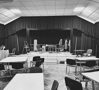 Storth Village Hall set up with a stage