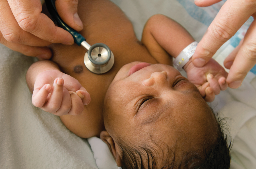 Clinician neonatal team consulting together