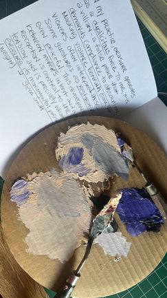 Naples Orange and Indigo on a cardboard palette and notes from a notebook