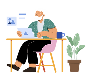 Older adult at table with laptop