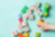 Child-playing-with-wooden-cubes-with-num