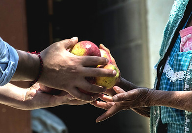 two persons holding fruits_edited.jpg