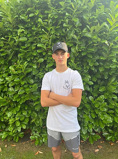 lad in white looking with cap.jpg