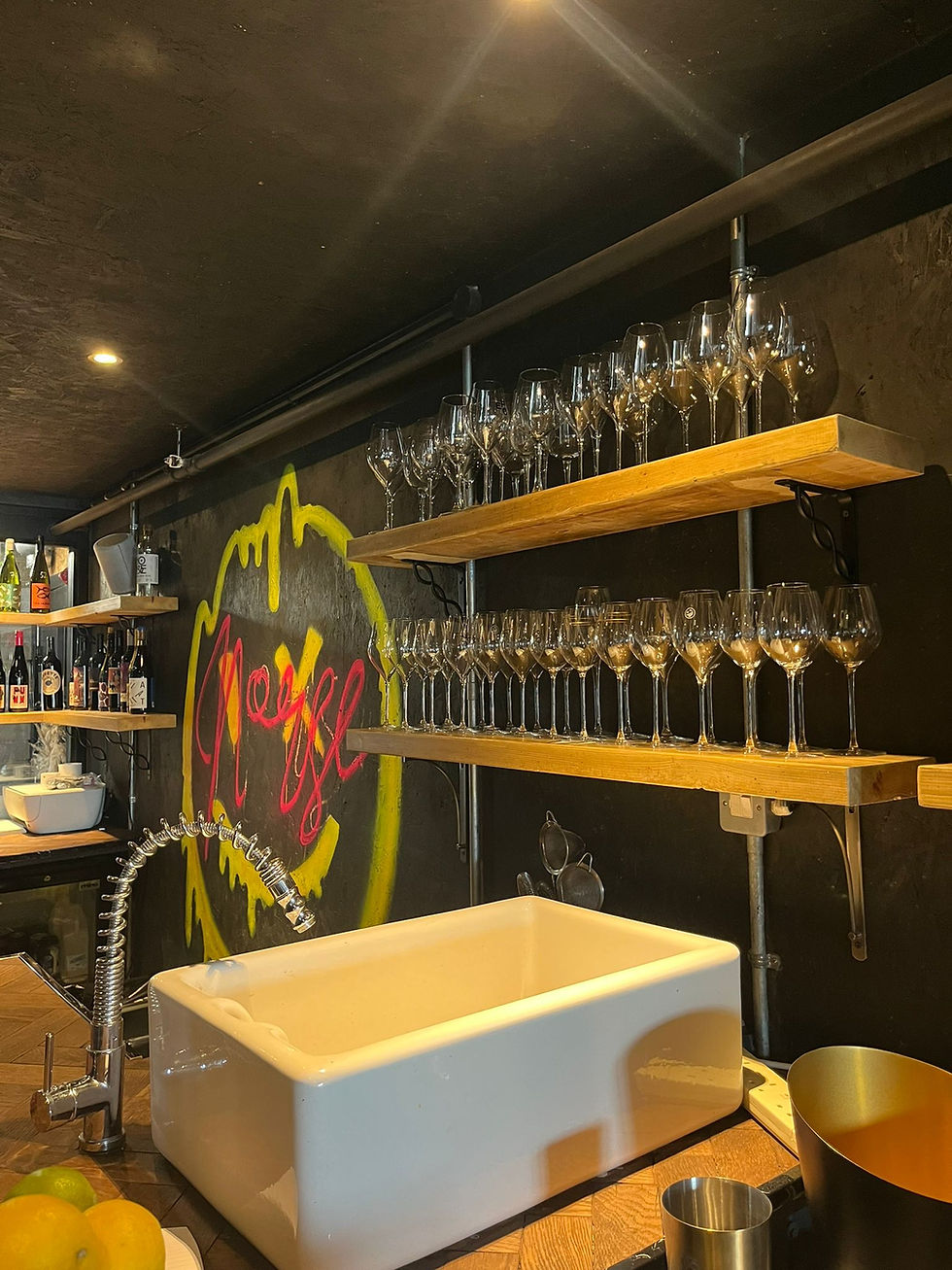 Graffiti wall behind bar