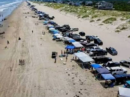 beach goers on the 4x4