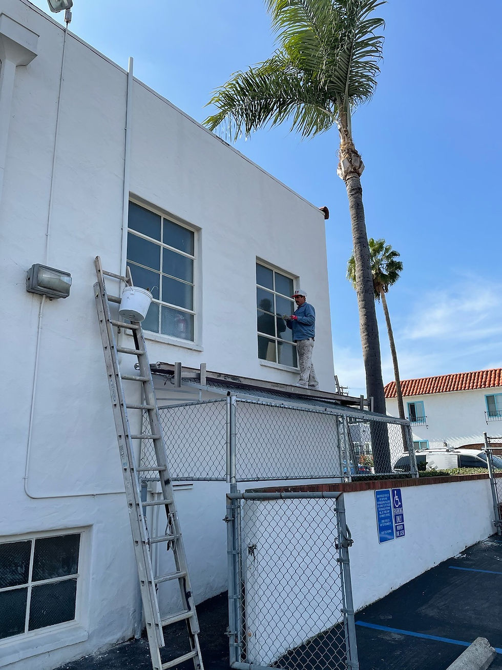 Side of Building with Plank and Ladder