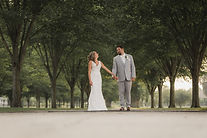 Michigan wedding photographer, Bearded Wolf Productions captures bride and groom holding hands at Packard Proving Grounds in Shelby Twp during wedding portraits.