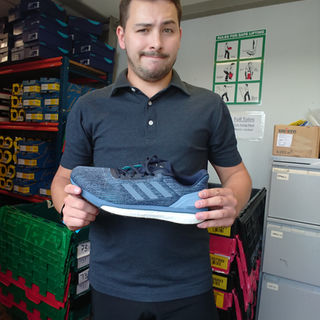 Standing in the stock room in the Runners Need store in Port Solent holding the left Adidas Solar Drive ST