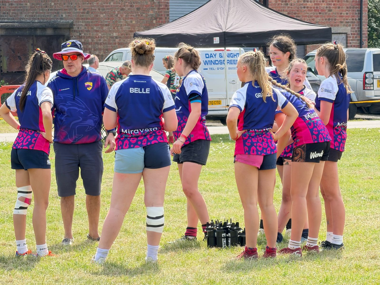 Coaching a girls' rugby team in MiraVeta-sponsored kit