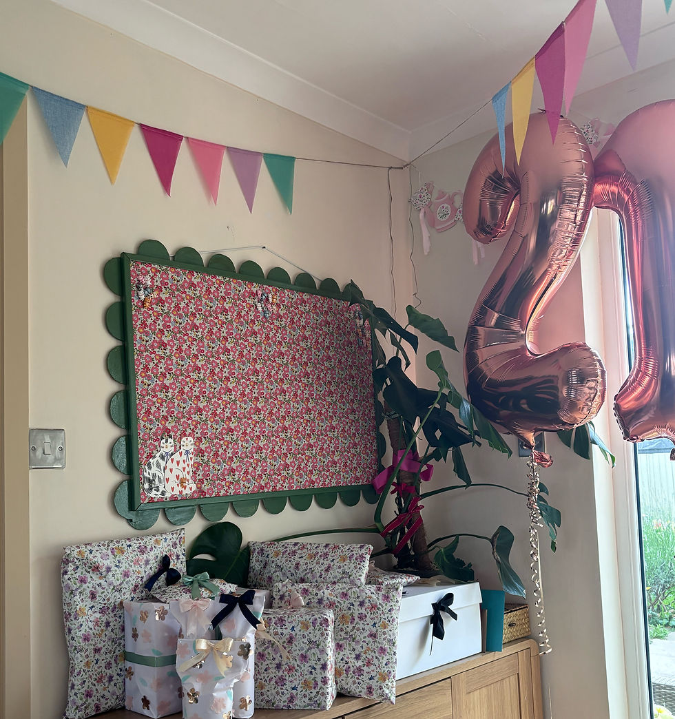 The Ellie Large Noticeboard with large amounts of birthday presents stacked beneath.