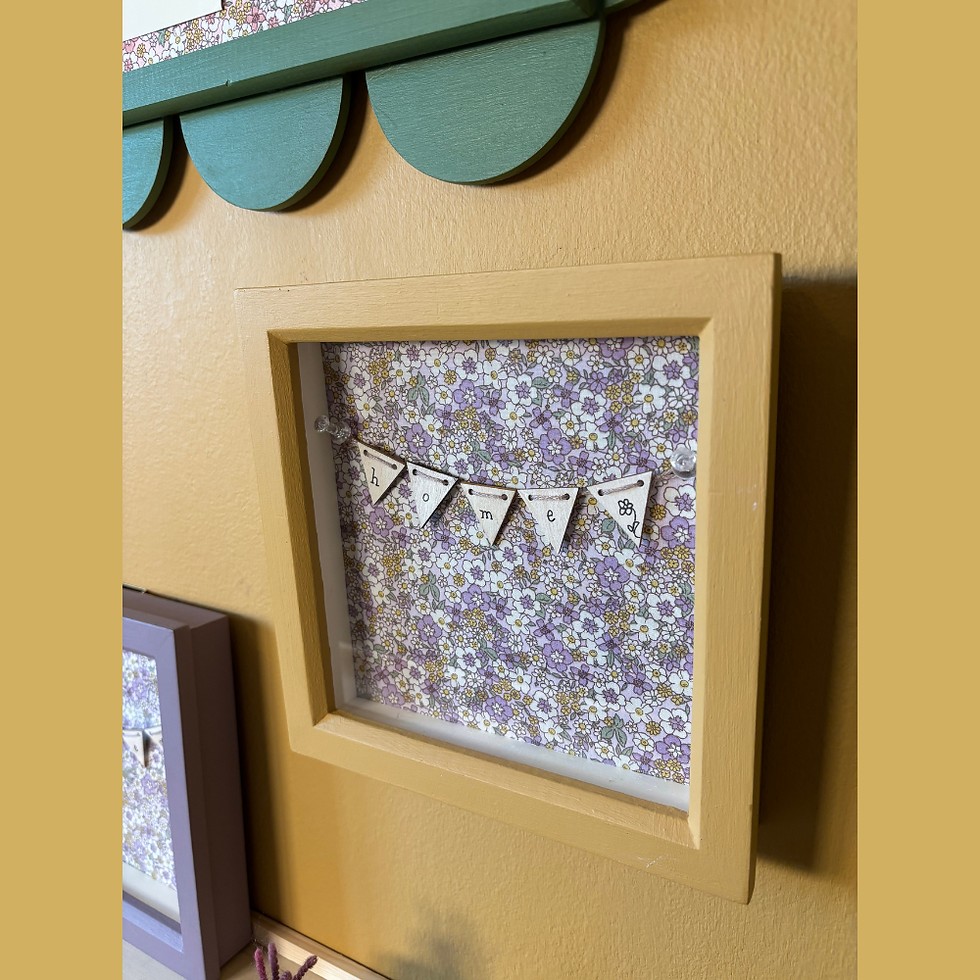 Thumbnail: Angled view of the Sophie 'Home' box frame with lilac floral fabric and yellow frame.