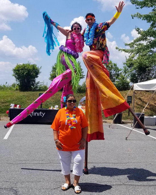 Hawaiian luau stilt party event costume Pickup-stix Pick up stix stilt walking walker. Professional insured performers in Cleveland Ohio. 