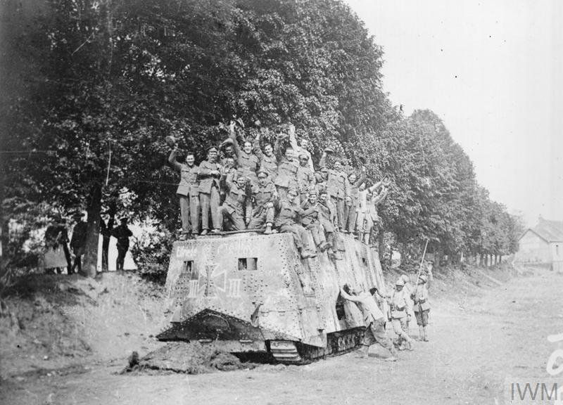 Group_of_soldiers_cheering_from_the_top_of_the_German_A7V_tank_named_Elfriede.jpg