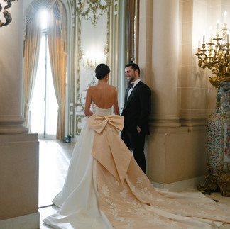 Bride and groom during their first look on the marble staircase at the Perry Belmont House.