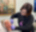 Jenna, owner of Cosmetic Medicine Center, wearing black long-sleeve shirt and purple gloves, injecting patien near jawline with dermal filler