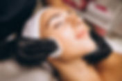 cosmetologist-cleaning-face-woman-beauty-salon.jpg