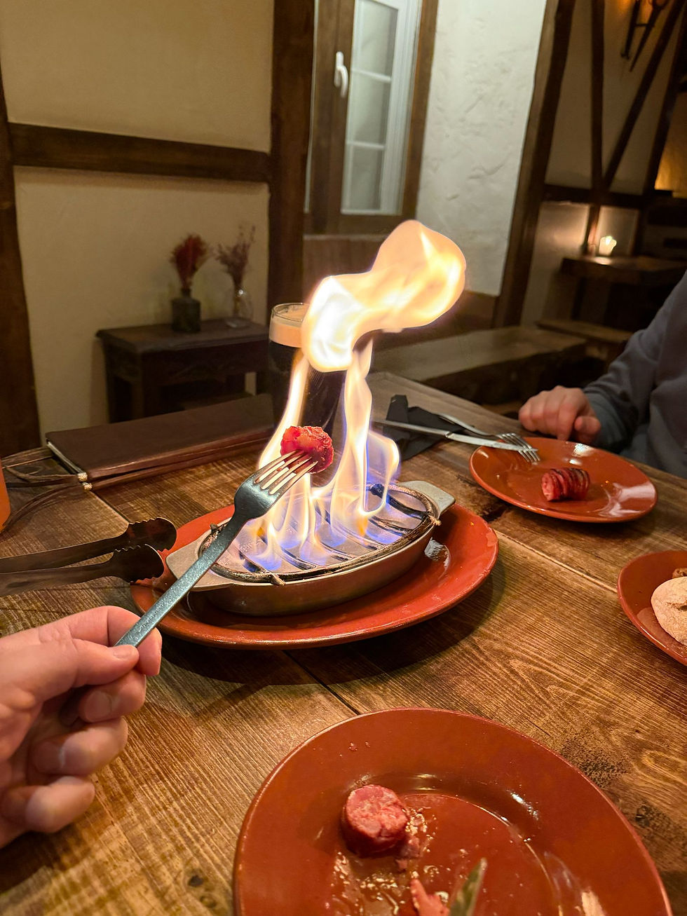 Must-try: the flaming chouriço with a glass of local red wine.