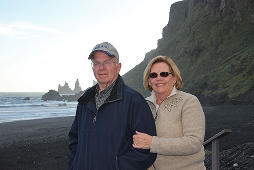 portrait of Gary and Susan Atwood at the black sand beach in Vík, Iceland