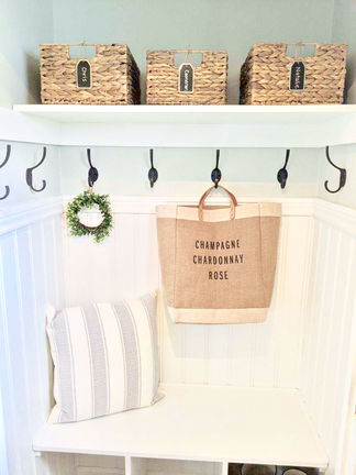 Simple chic storage: A coastal farmhouse mudroom closet