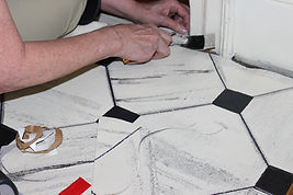 Jennifer Frantz instaling the floor cloth