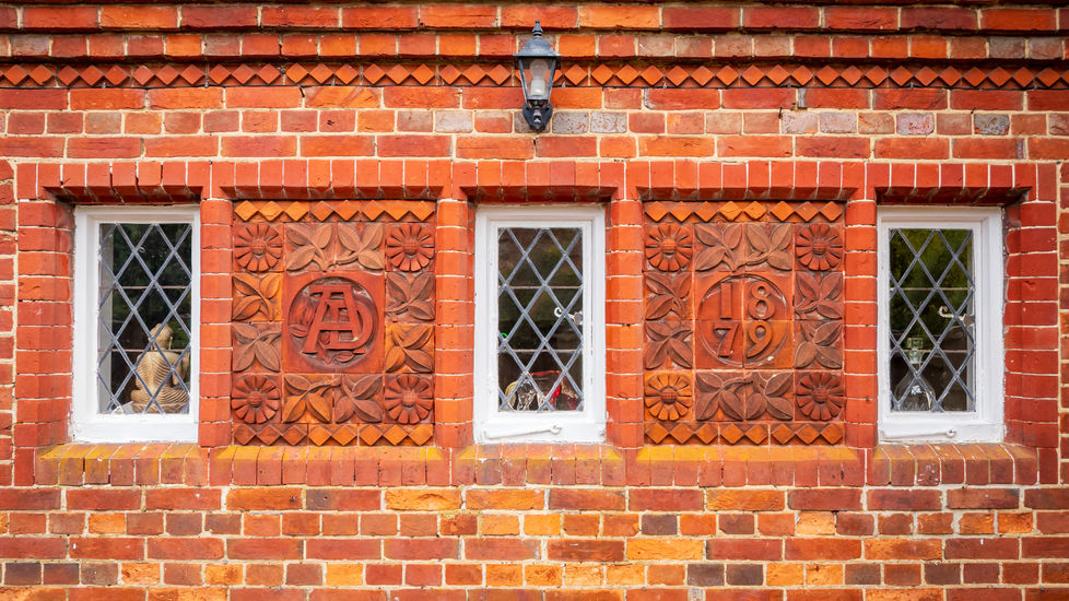 Decorative brickwork and original window detail on a period property