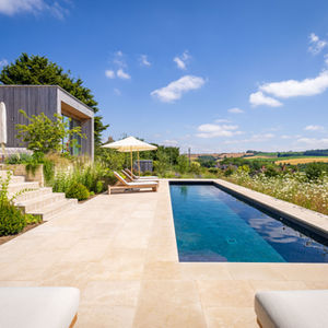 Contemporary garden with swimming pool and landscaped terrace