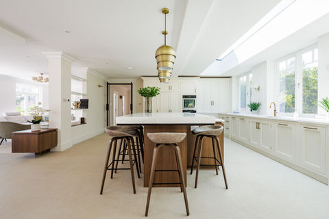 High-end kitchen with handcrafted island in a Haslemere home, photographed by Fi Digby-Jones.